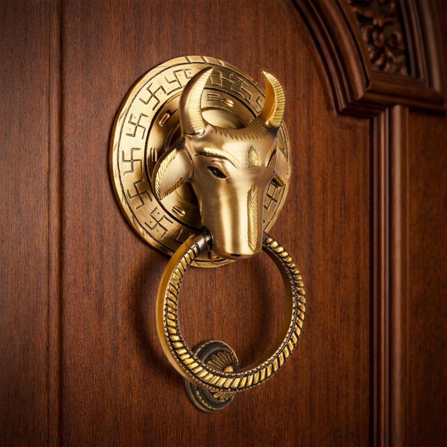 Nandi Majesty brass knocker mounted on a carved teak door